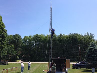 Rick, K1OT, climbs the tower