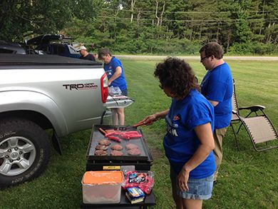 Annette cooks franks and burgers