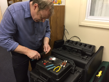 Paul works on wiring the battery backup
