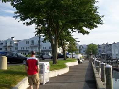 Thom walks along the marina
